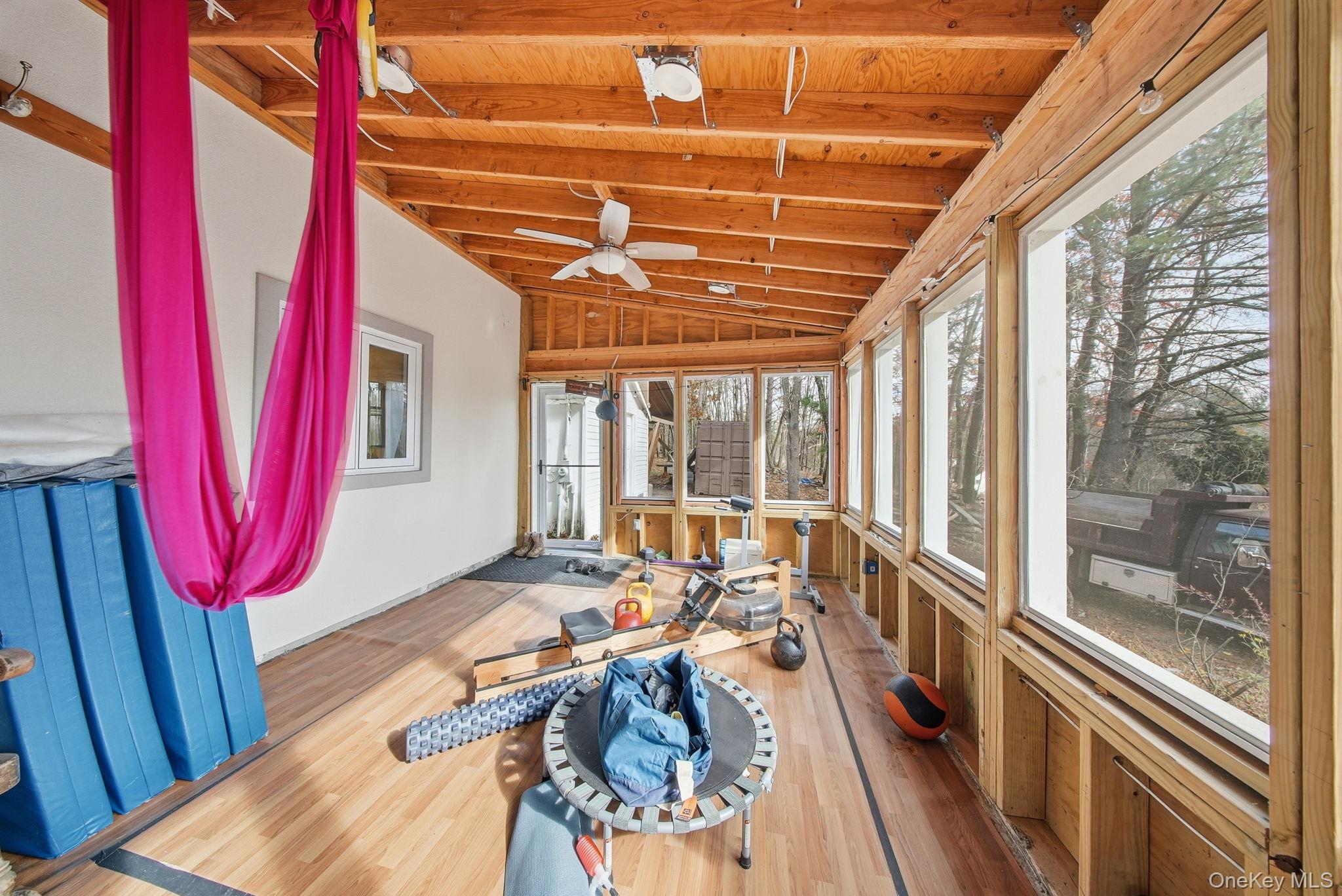 52 Martins Road Huguenot, NY 12746 - Photo 23 of 26 a view of a balcony with couch and wooden floor