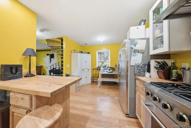 a kitchen with a table and chairs
