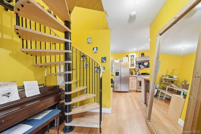 a reading room with furniture and wooden floor