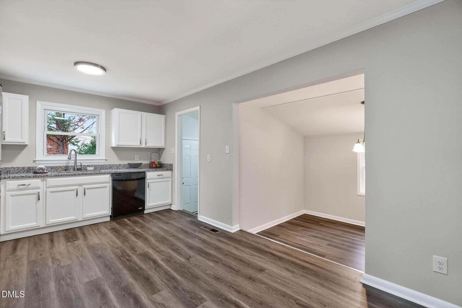 517 Cooper Road Raleigh, NC 27610 - Photo 11 of 29 a kitchen with a refrigerator sink and cabinets