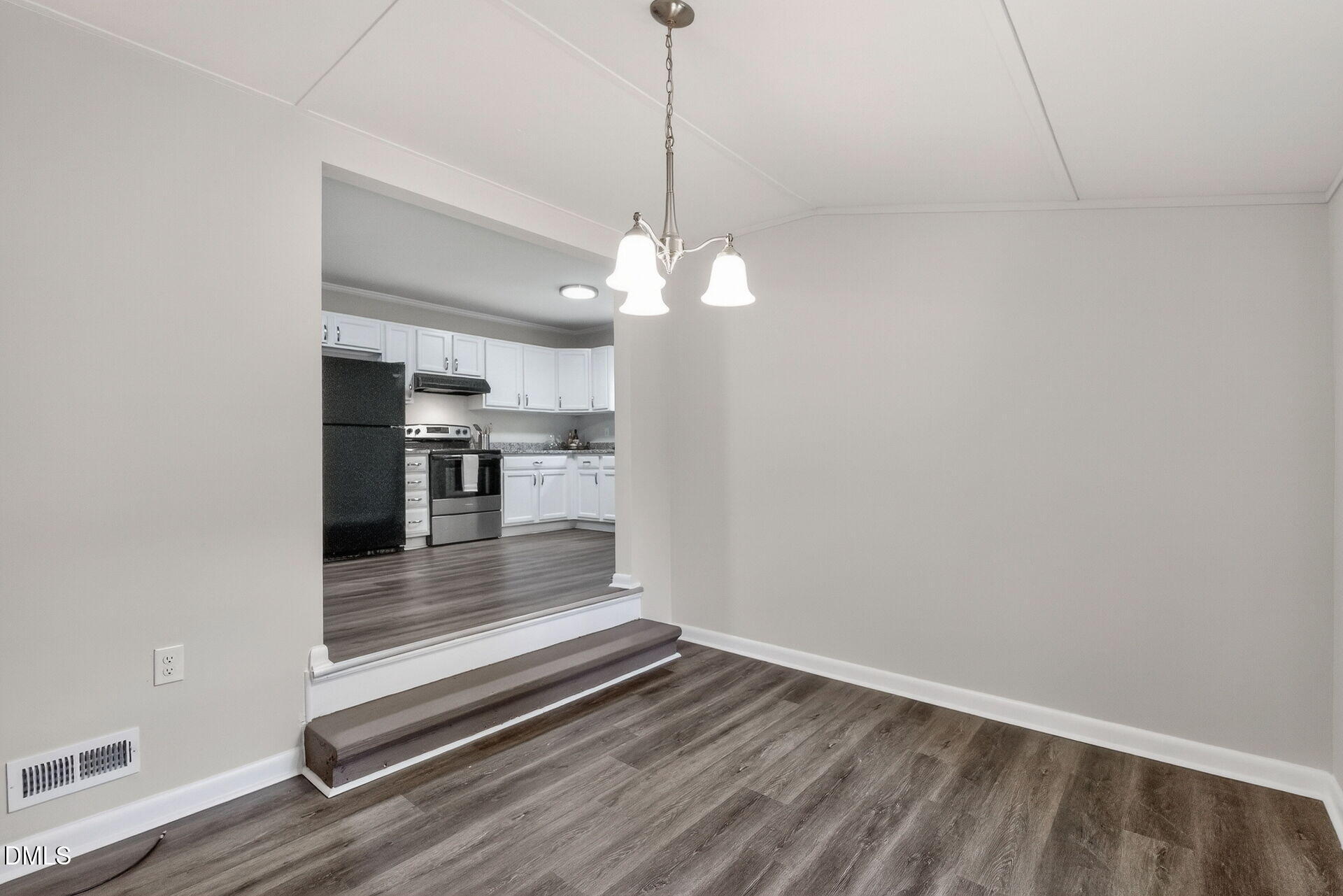 517 Cooper Road Raleigh, NC 27610 - Photo 12 of 29 a view of a room with wooden floor and a ceiling fan