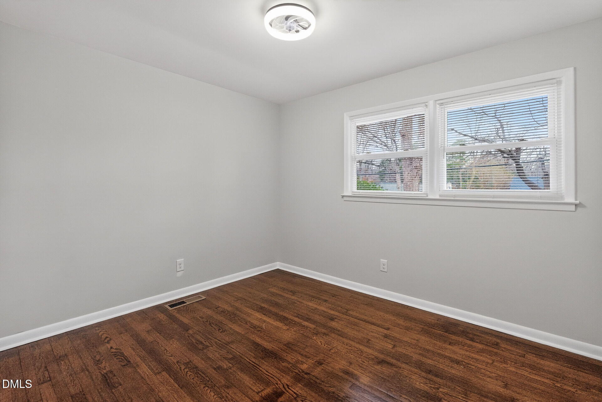 517 Cooper Road Raleigh, NC 27610 - Photo 24 of 29 a view of empty room with wooden floor and fan