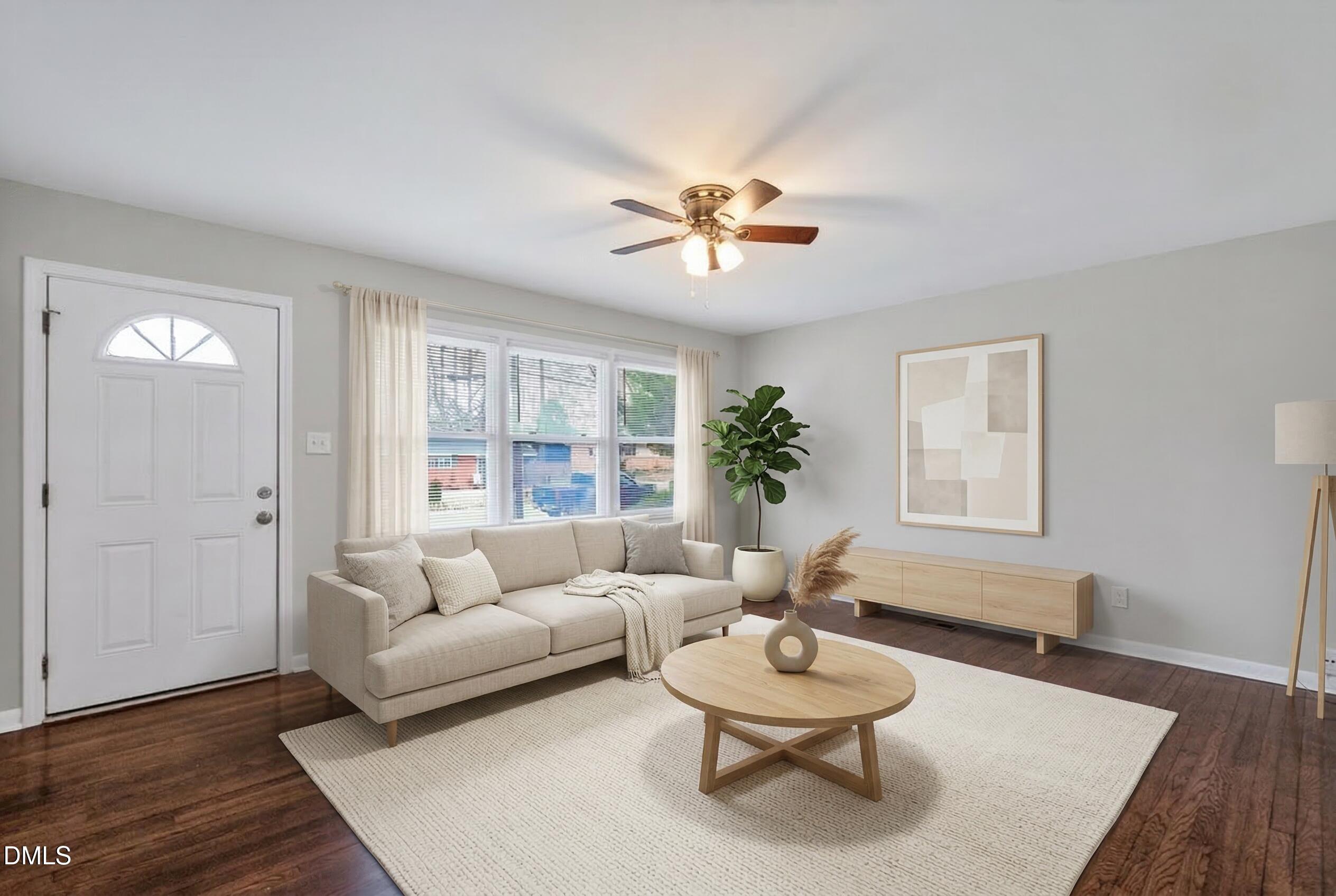 517 Cooper Road Raleigh, NC 27610 - Photo 5 of 29 a living room with furniture and a table