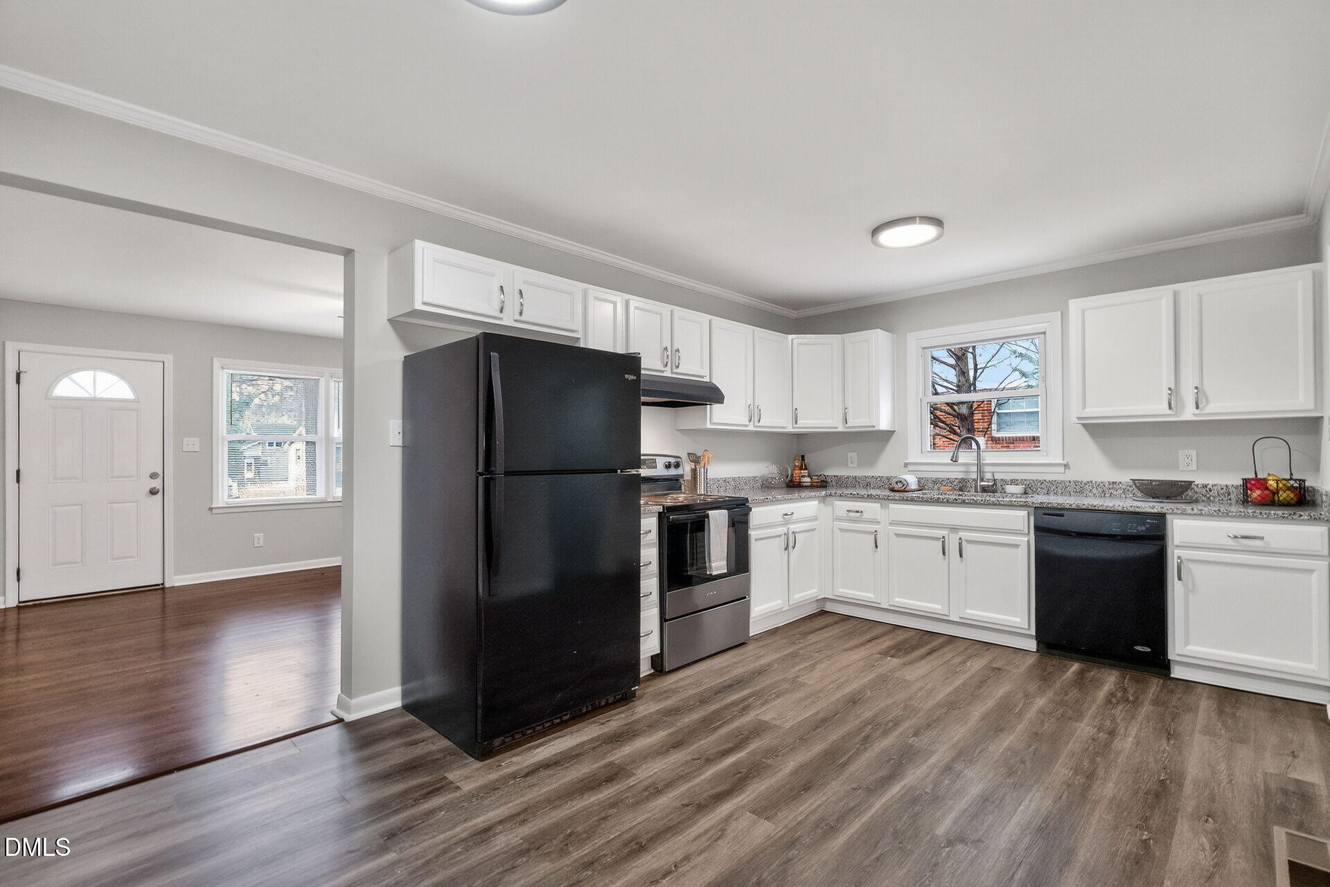 517 Cooper Road Raleigh, NC 27610 - Photo 9 of 29 a kitchen with a refrigerator and a stove top oven