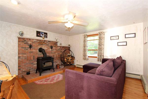 160 Middle Road Southborough, MA 01772 - Photo 12 of 28 a living room with furniture a chandelier and a flat screen tv