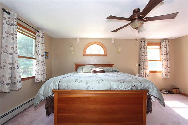 160 Middle Road Southborough, MA 01772 - Photo 14 of 28 a bed sitting in a bedroom next to a window