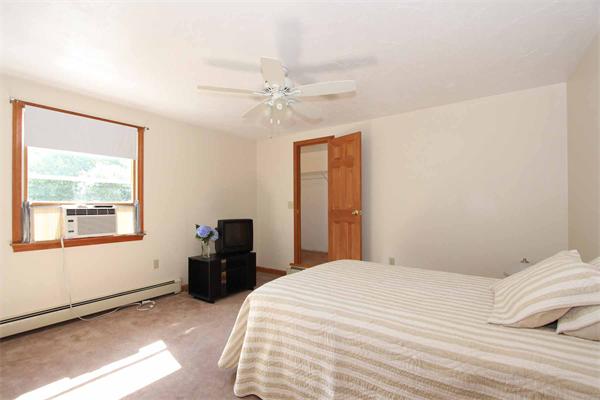 160 Middle Road Southborough, MA 01772 - Photo 21 of 28 a bedroom with a bed and a window