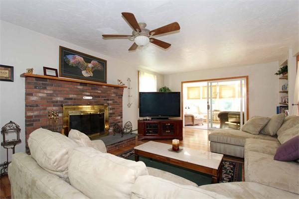 160 Middle Road Southborough, MA 01772 - Photo 4 of 28 a living room with furniture a fireplace and a flat screen tv