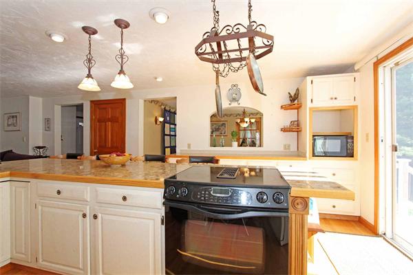 160 Middle Road Southborough, MA 01772 - Photo 8 of 28 a kitchen with a stove and a chandelier