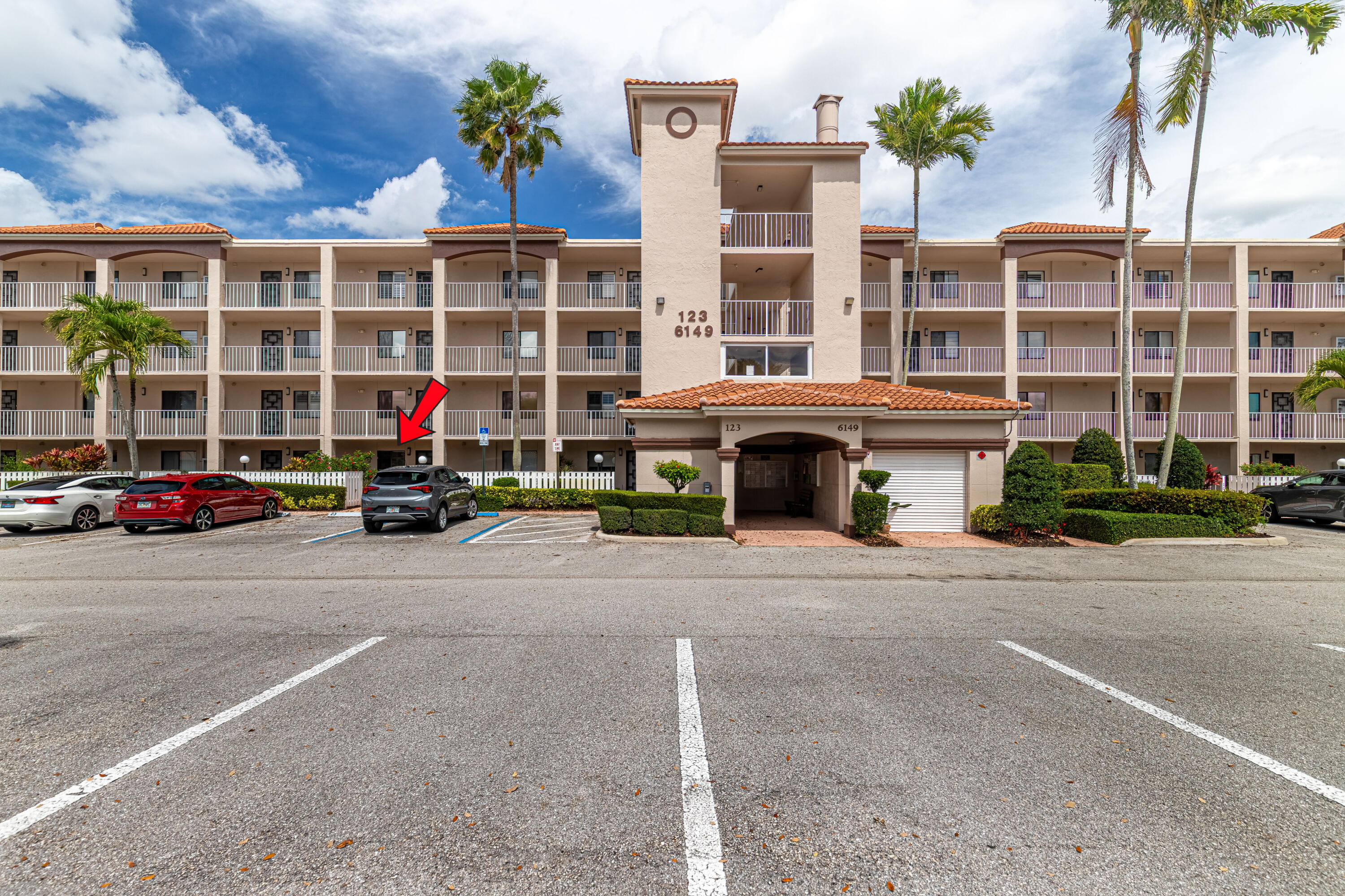 6149 Pointe Regal Circle, Unit 104 Delray Beach, FL 33484 - Photo 1 of 64 a car parked in front of a building