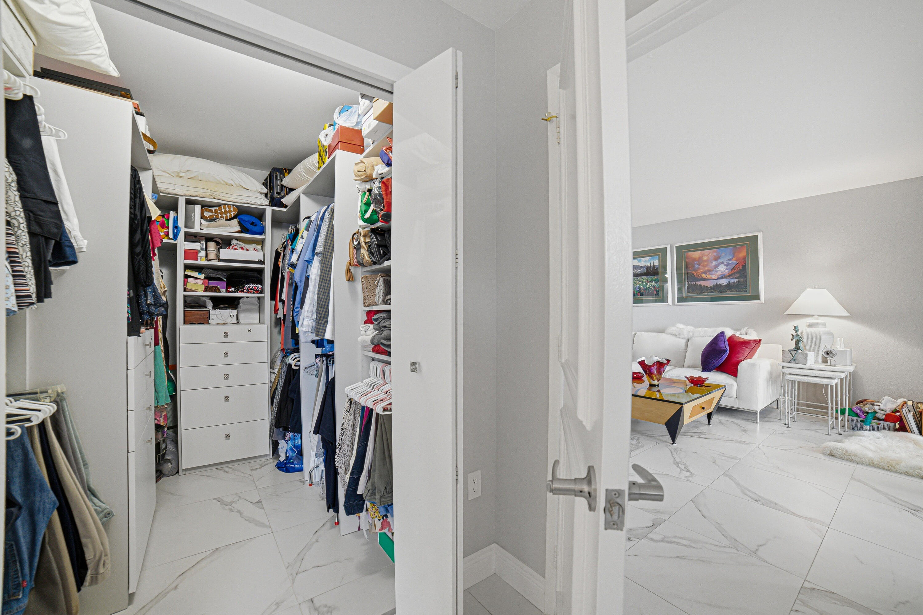 6149 Pointe Regal Circle, Unit 104 Delray Beach, FL 33484 - Photo 22 of 64 Walk-In Closet & Living Room