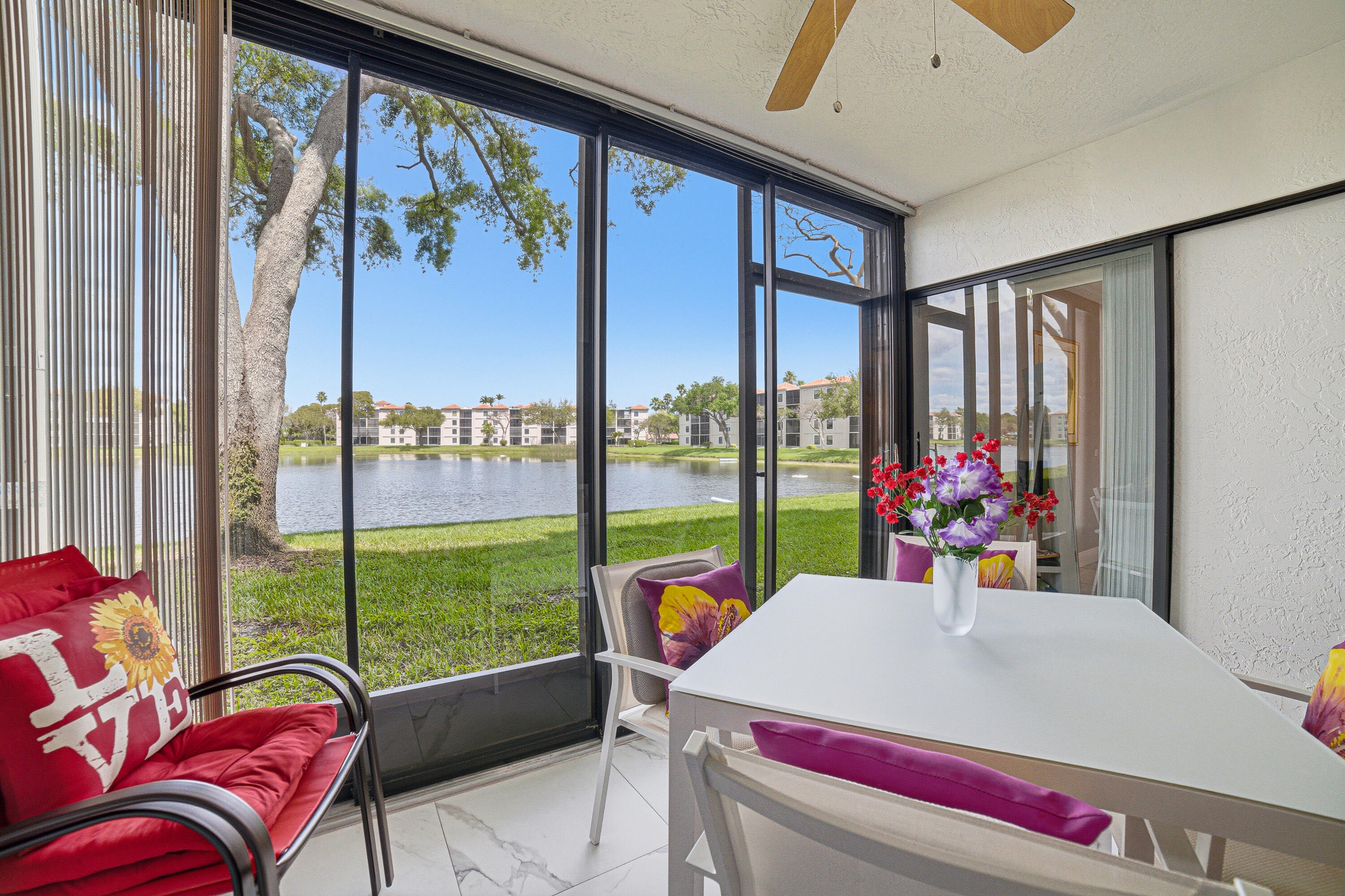 6149 Pointe Regal Circle, Unit 104 Delray Beach, FL 33484 - Photo 31 of 64 a very nice looking room with a large window