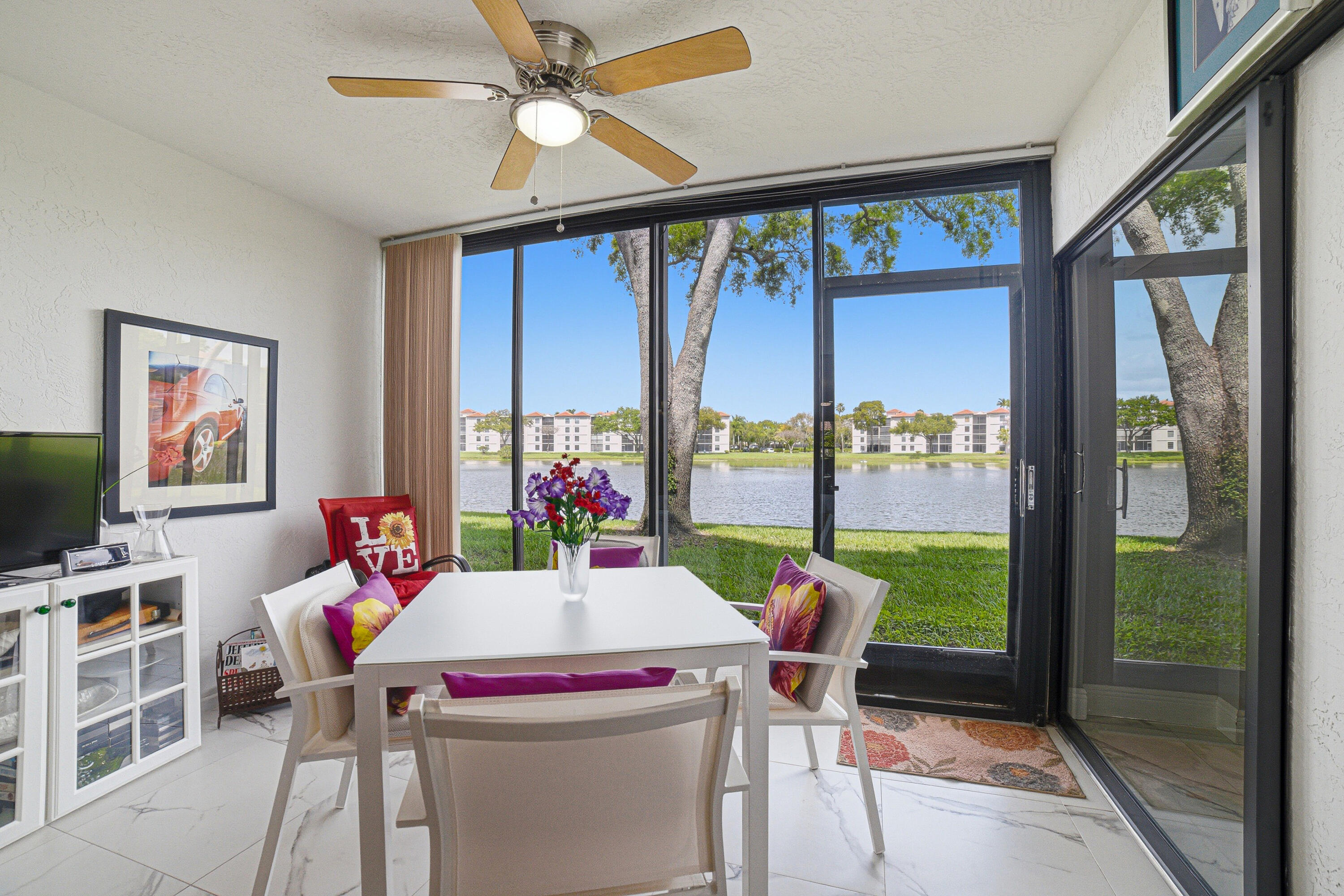 6149 Pointe Regal Circle, Unit 104 Delray Beach, FL 33484 - Photo 32 of 64 a outdoor dining space with furniture and garden view