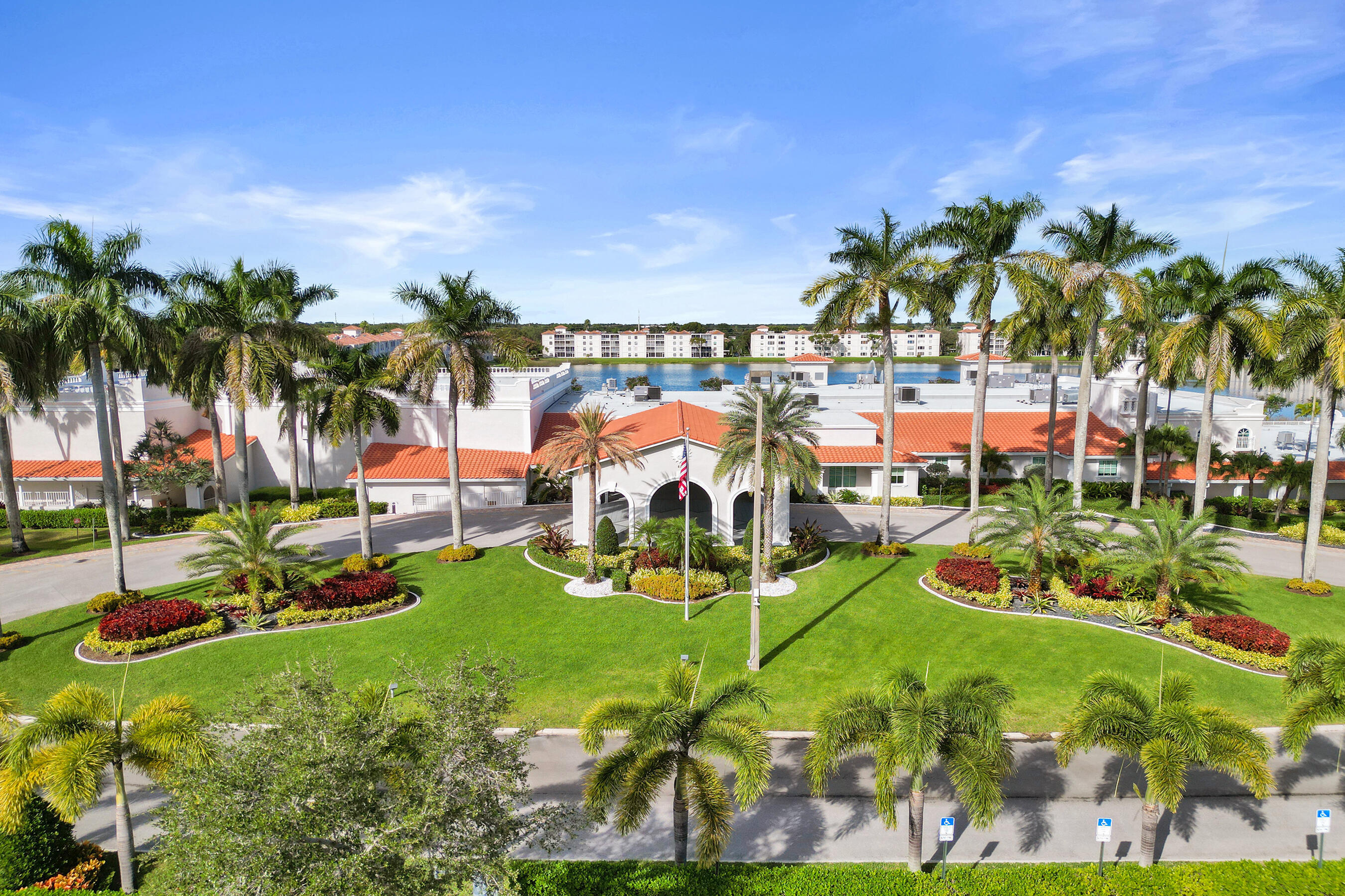 6149 Pointe Regal Circle, Unit 104 Delray Beach, FL 33484 - Photo 38 of 64 an outdoor space with lots of palm trees