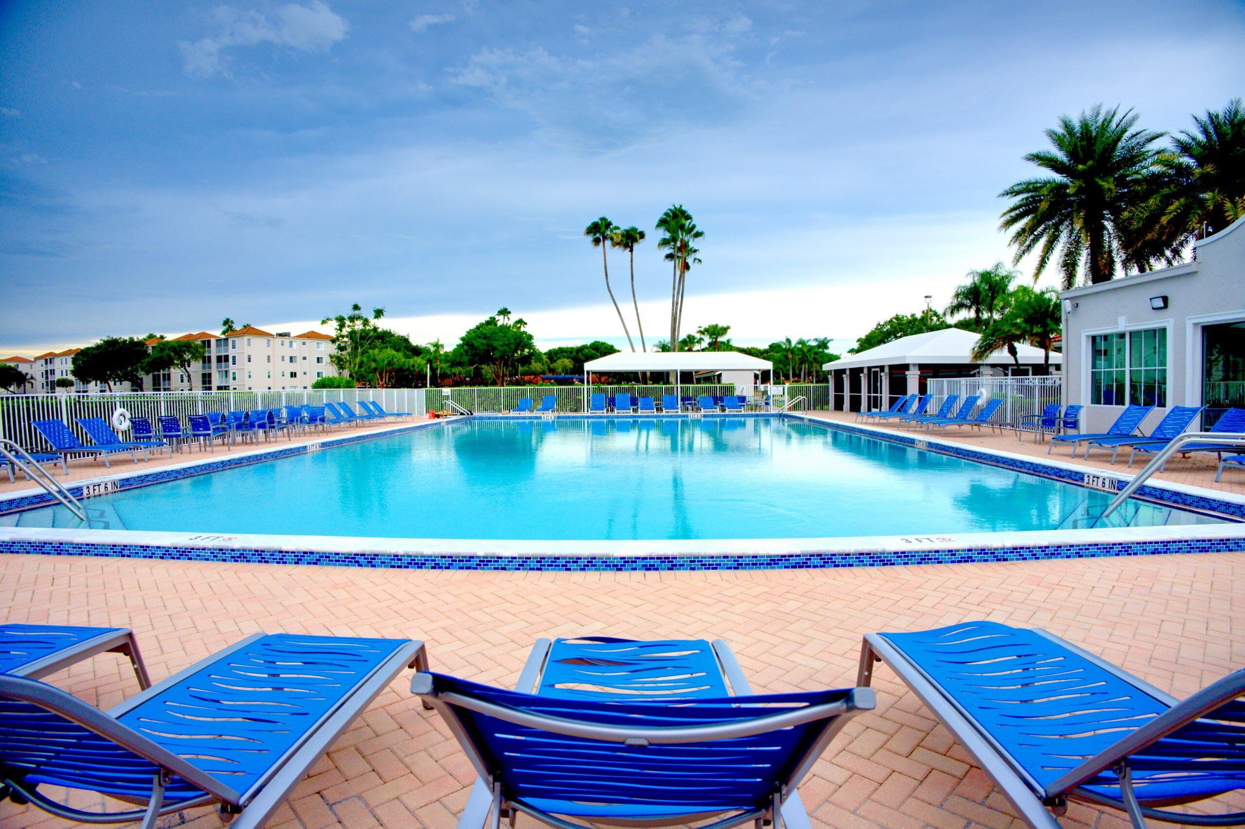 6149 Pointe Regal Circle, Unit 104 Delray Beach, FL 33484 - Photo 53 of 64 swimming pool with outdoor seating