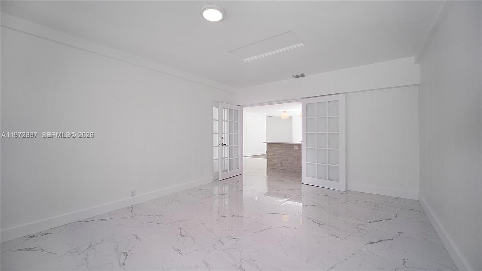 11690 Southwest 81st Road, Unit 11690 Pinecrest, FL 33156 - Photo 14 of 26 a view of an empty room