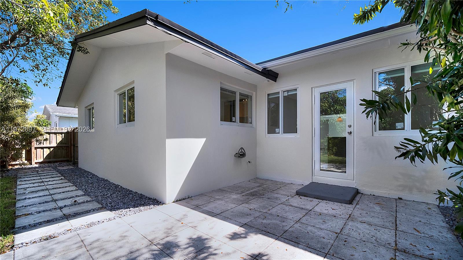 11690 Southwest 81st Road, Unit 11690 Pinecrest, FL 33156 - Photo 26 of 26 a view of a house with a yard