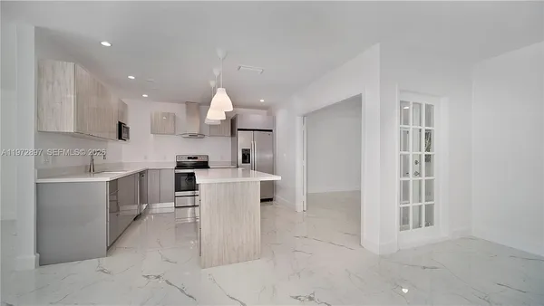 a kitchen with sink cabinets and window
