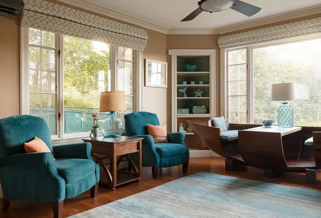a dining room with furniture and window