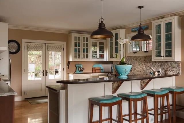 a kitchen with stainless steel appliances granite countertop a stove and a sink
