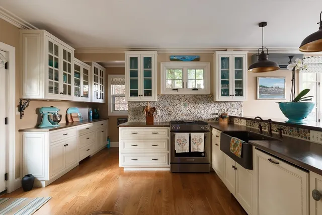 a kitchen with granite countertop a window