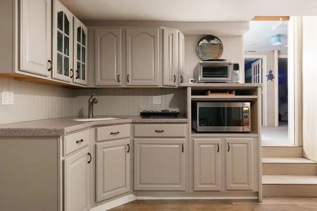 a refrigerator freezer sitting inside of a kitchen