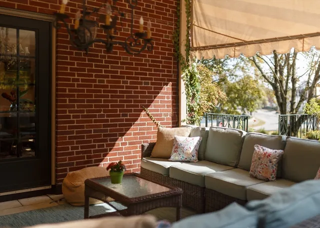 a view of a chairs and table in patio