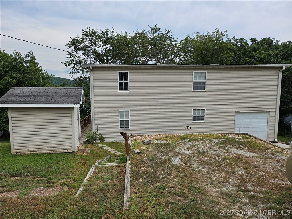 22 Launch Landing Edwards, MO 65326 - Photo 5 of 48 Roadside view of house, well house & garage