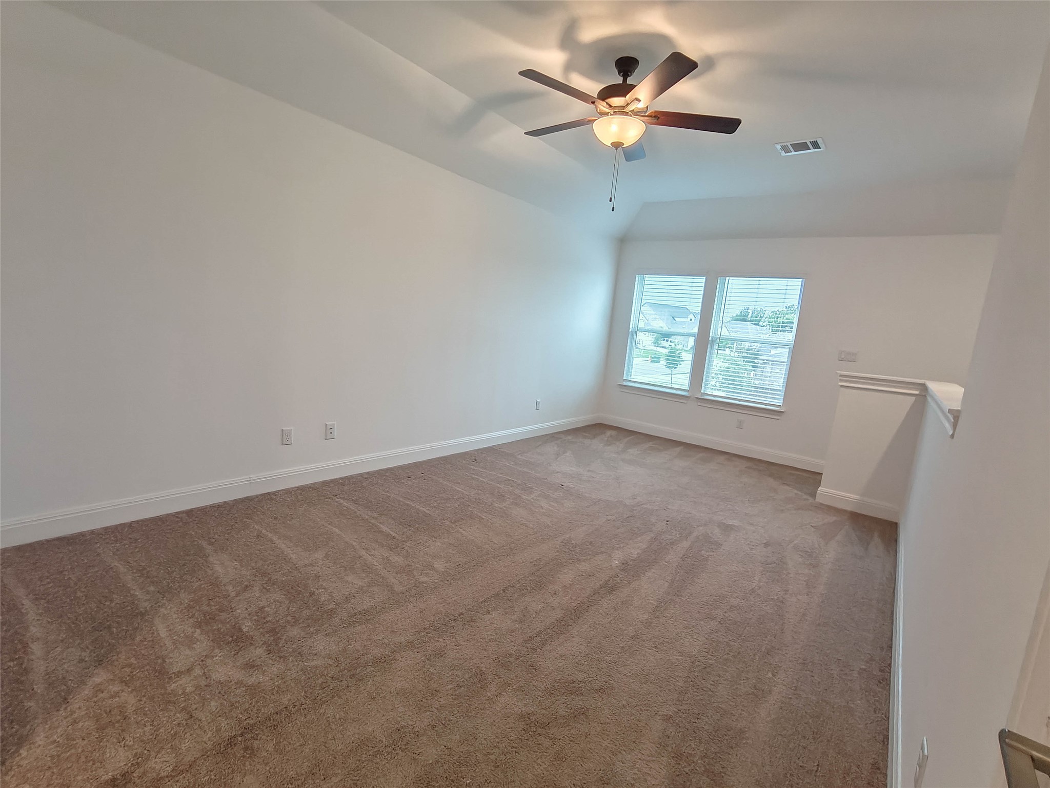 200 Fiddleneck Road Marble Falls, TX 78654 - Photo 23 of 37 an empty room with windows and fan