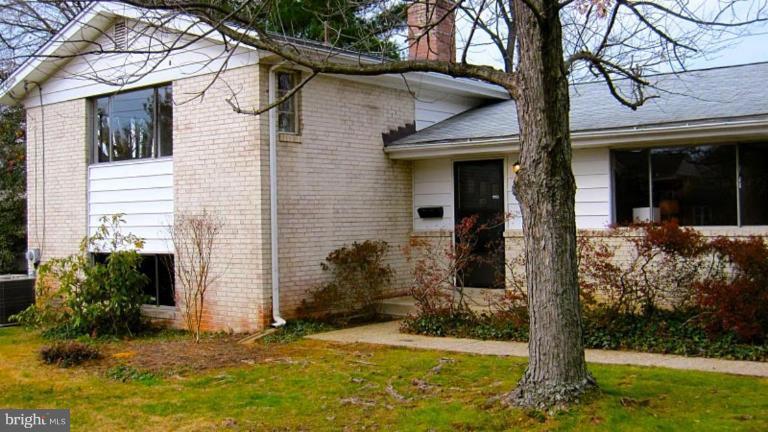 6115 Greentree Road Bethesda, MD 20817 - Photo 1 of 19 a view of a house with yard and a tree