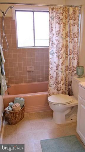 6115 Greentree Road Bethesda, MD 20817 - Photo 18 of 19 a bathroom with a toilet and a shower