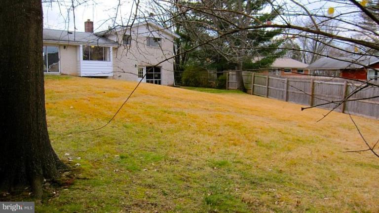 6115 Greentree Road Bethesda, MD 20817 - Photo 3 of 19 a backyard of a house with large trees