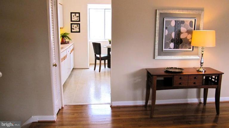 6115 Greentree Road Bethesda, MD 20817 - Photo 4 of 19 a view of a livingroom with furniture and wooden floor