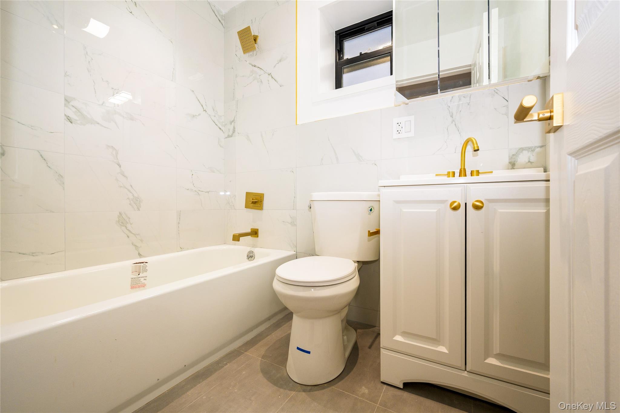 33-34 109th Street Queens, NY 11368 - Photo 13 of 26 a bathroom with a toilet and a sink