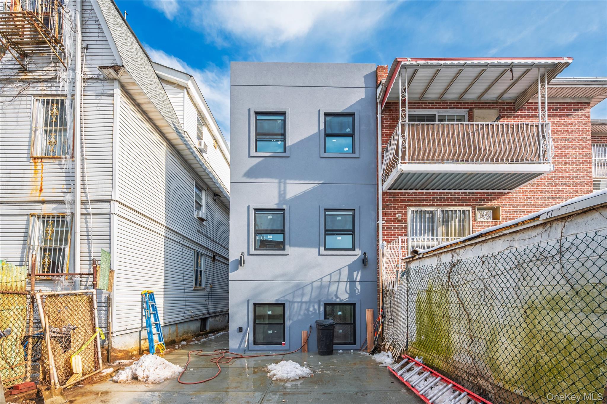 33-34 109th Street Queens, NY 11368 - Photo 4 of 26 a front view of a house with a yard
