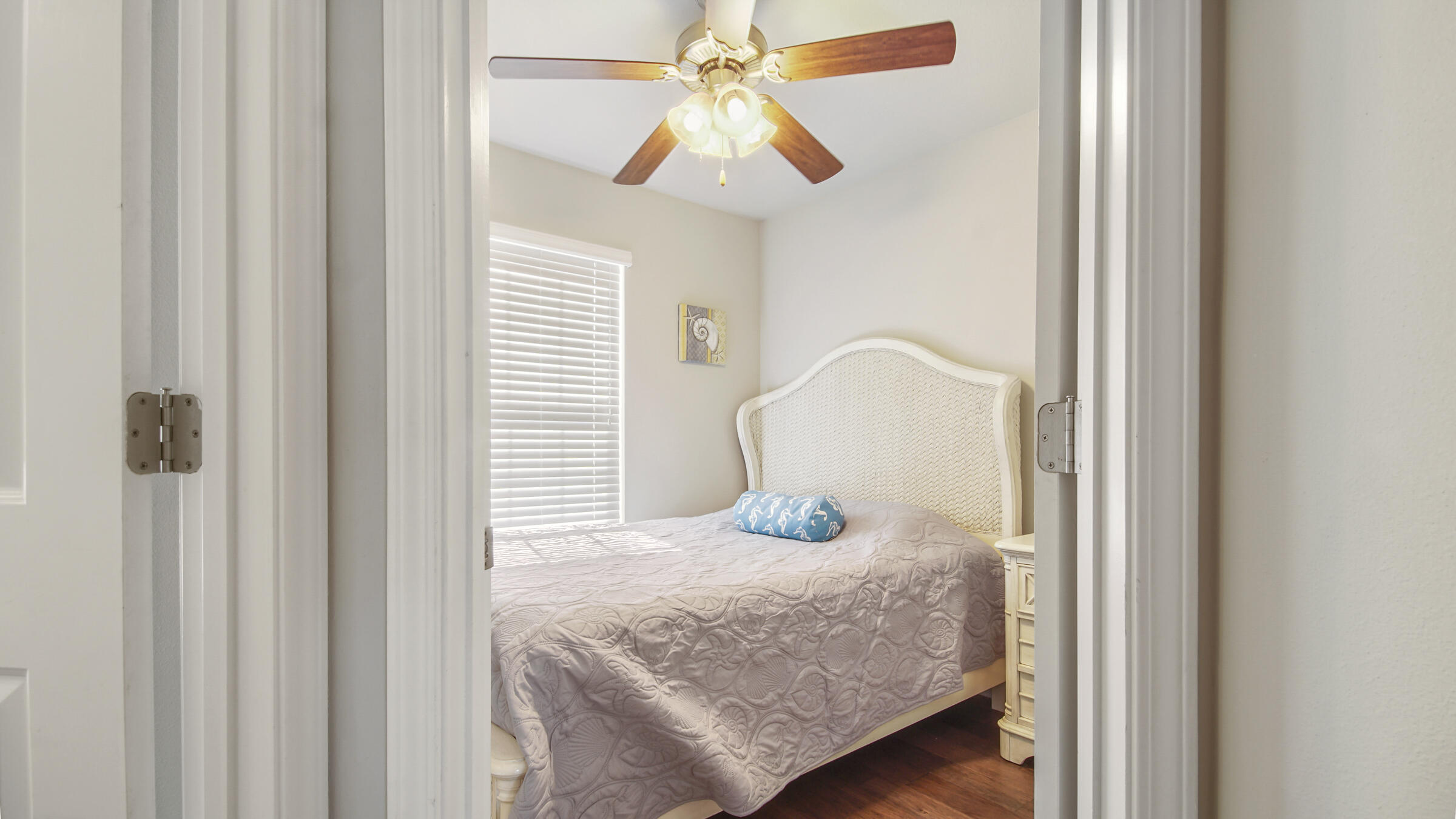30 Grayling Way Inlet Beach, FL 32461 - Photo 20 of 26 a bedroom with a bed and a chandelier