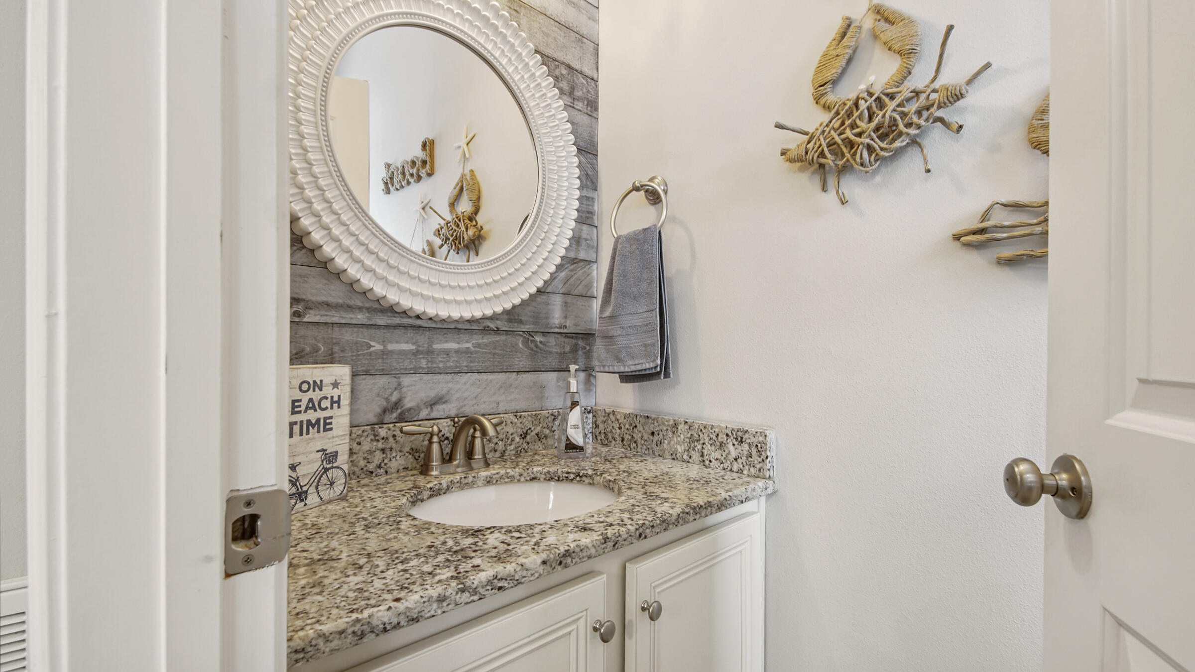 30 Grayling Way Inlet Beach, FL 32461 - Photo 3 of 26 a bathroom with a granite countertop sink and a mirror
