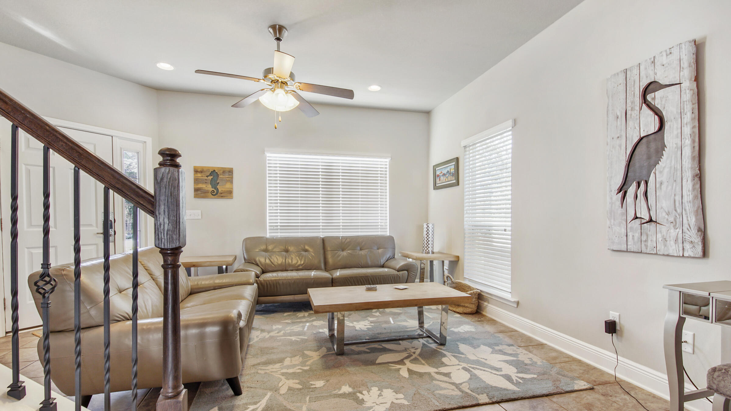 30 Grayling Way Inlet Beach, FL 32461 - Photo 5 of 26 a living room with furniture a rug and a chandelier