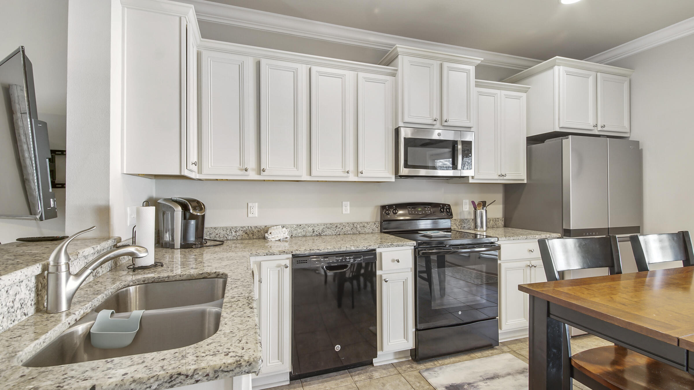 30 Grayling Way Inlet Beach, FL 32461 - Photo 9 of 26 a kitchen with stainless steel appliances granite countertop a sink stove and refrigerator