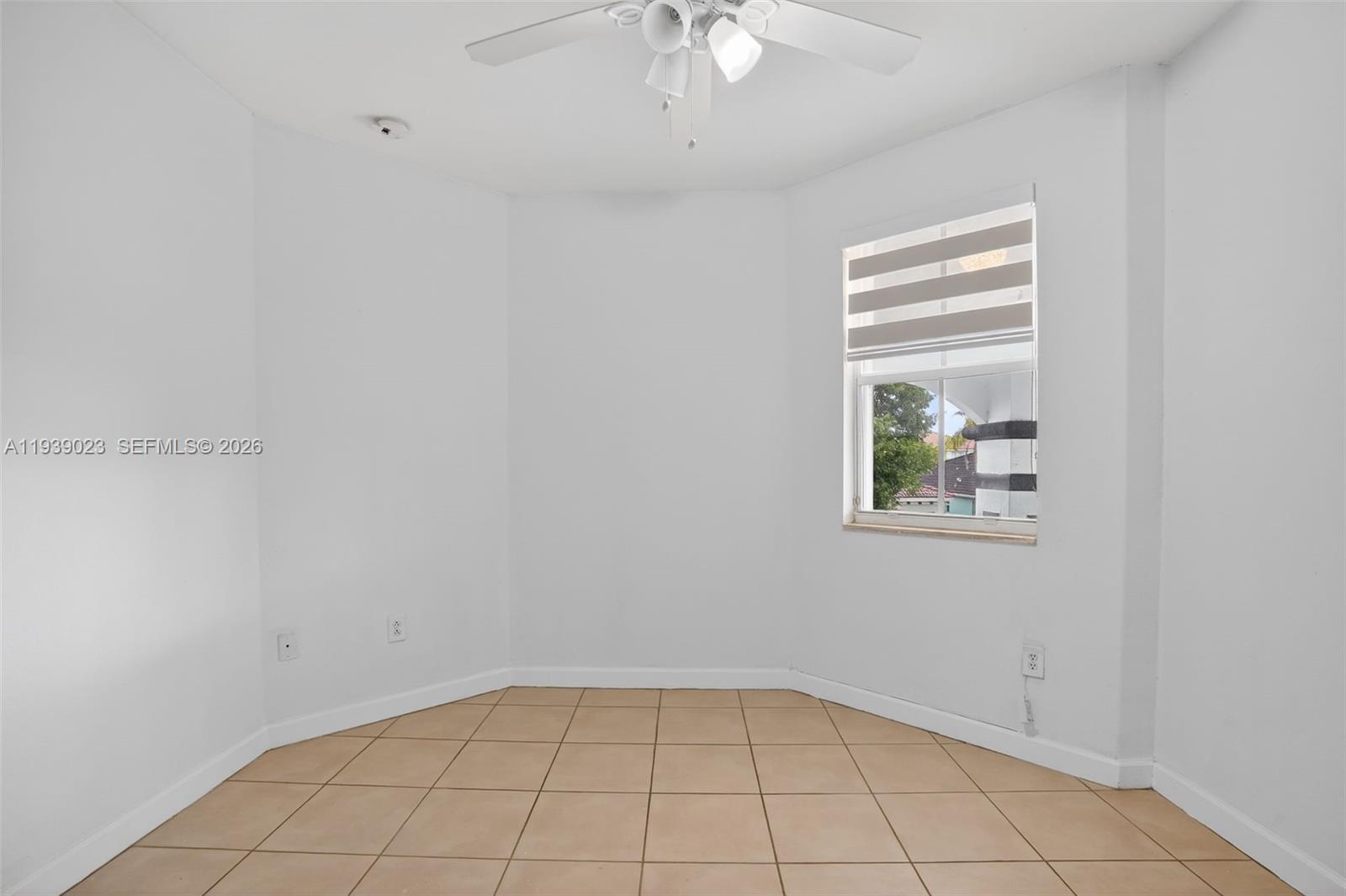 15051 Southwest 18th Terrace Miami, FL 33185 - Photo 13 of 42 a view of an empty room with a window