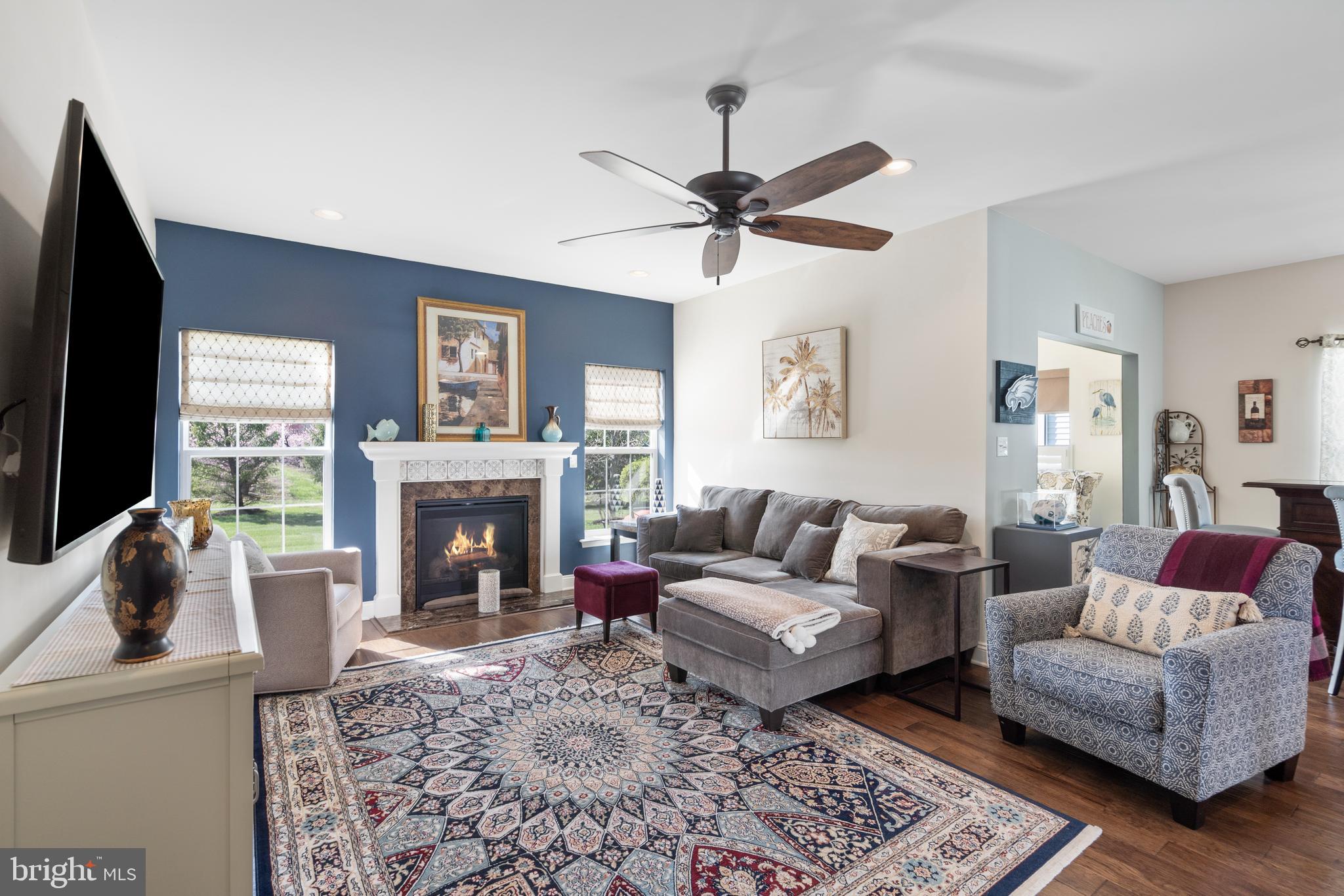 118 Field Loop Glassboro, NJ 08028 - Photo 14 of 51 a living room with furniture a fireplace and a flat screen tv