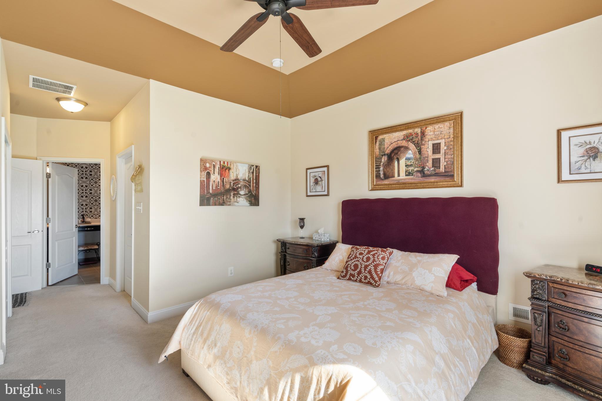 118 Field Loop Glassboro, NJ 08028 - Photo 22 of 51 a bedroom with a large bed and a chandelier