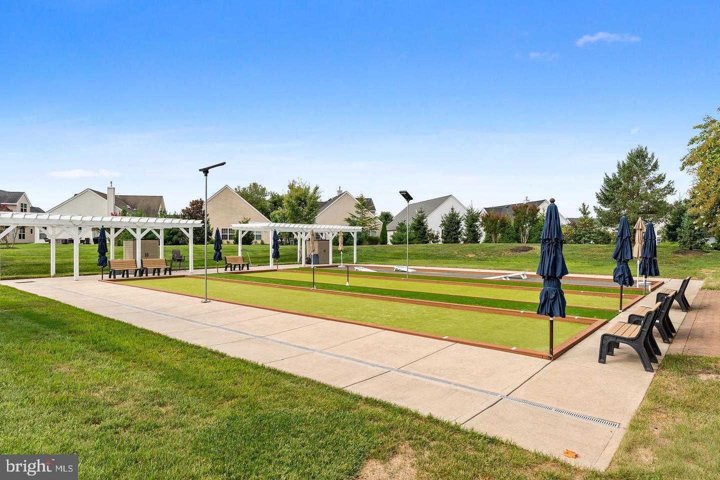 118 Field Loop Glassboro, NJ 08028 - Photo 40 of 51 a view of a swimming pool with lawn chairs and a big yard