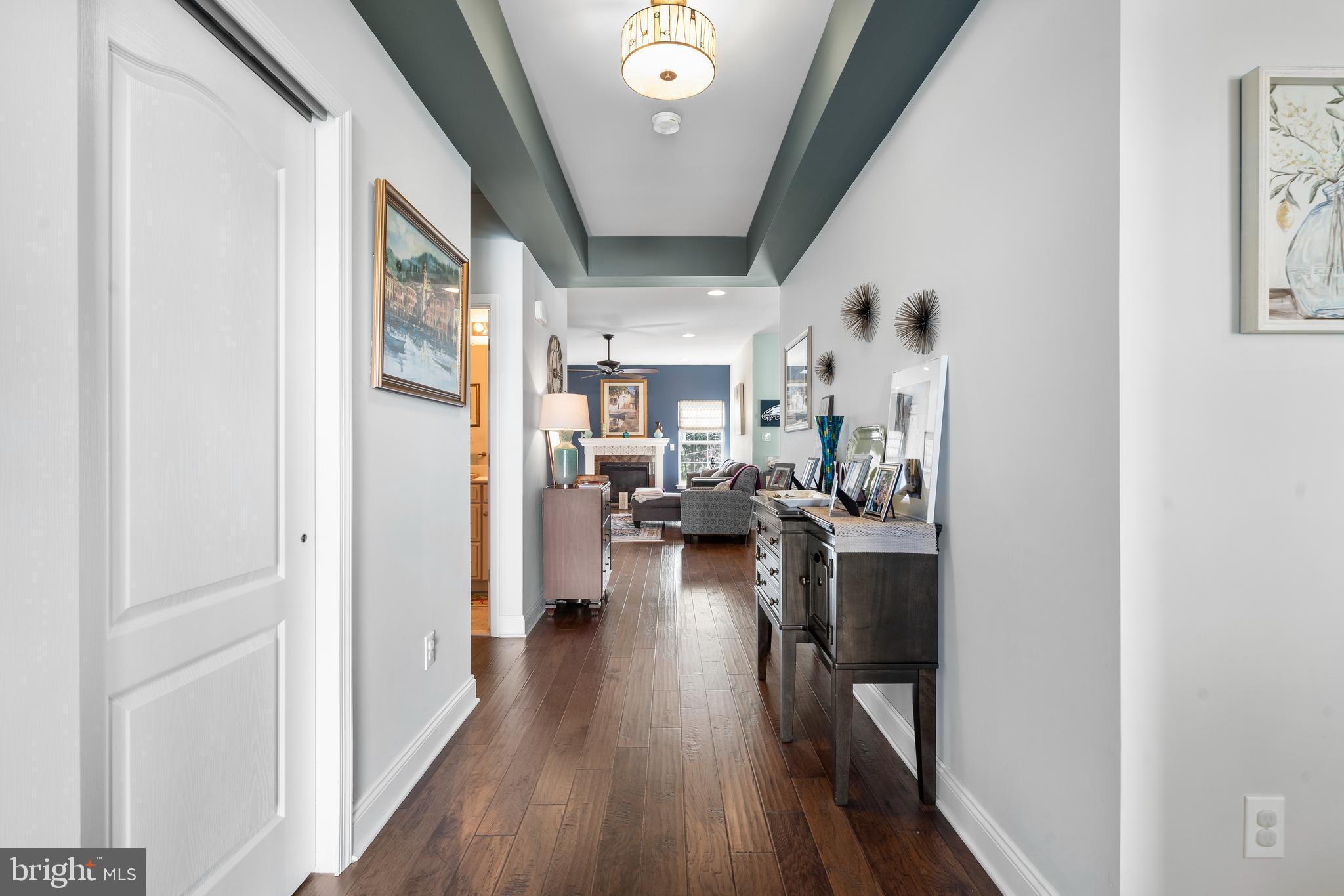 118 Field Loop Glassboro, NJ 08028 - Photo 4 of 51 a view of a living room and a livingroom with furniture and wooden floor