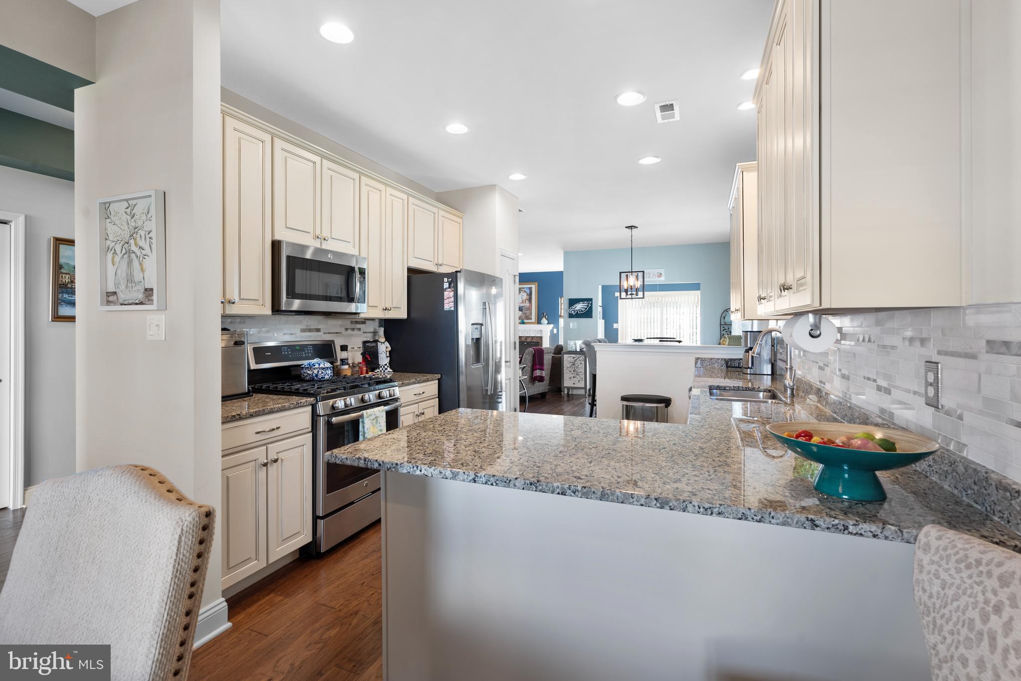 118 Field Loop Glassboro, NJ 08028 - Photo 6 of 51 a kitchen with stainless steel appliances granite countertop sink stove refrigerator and cabinets