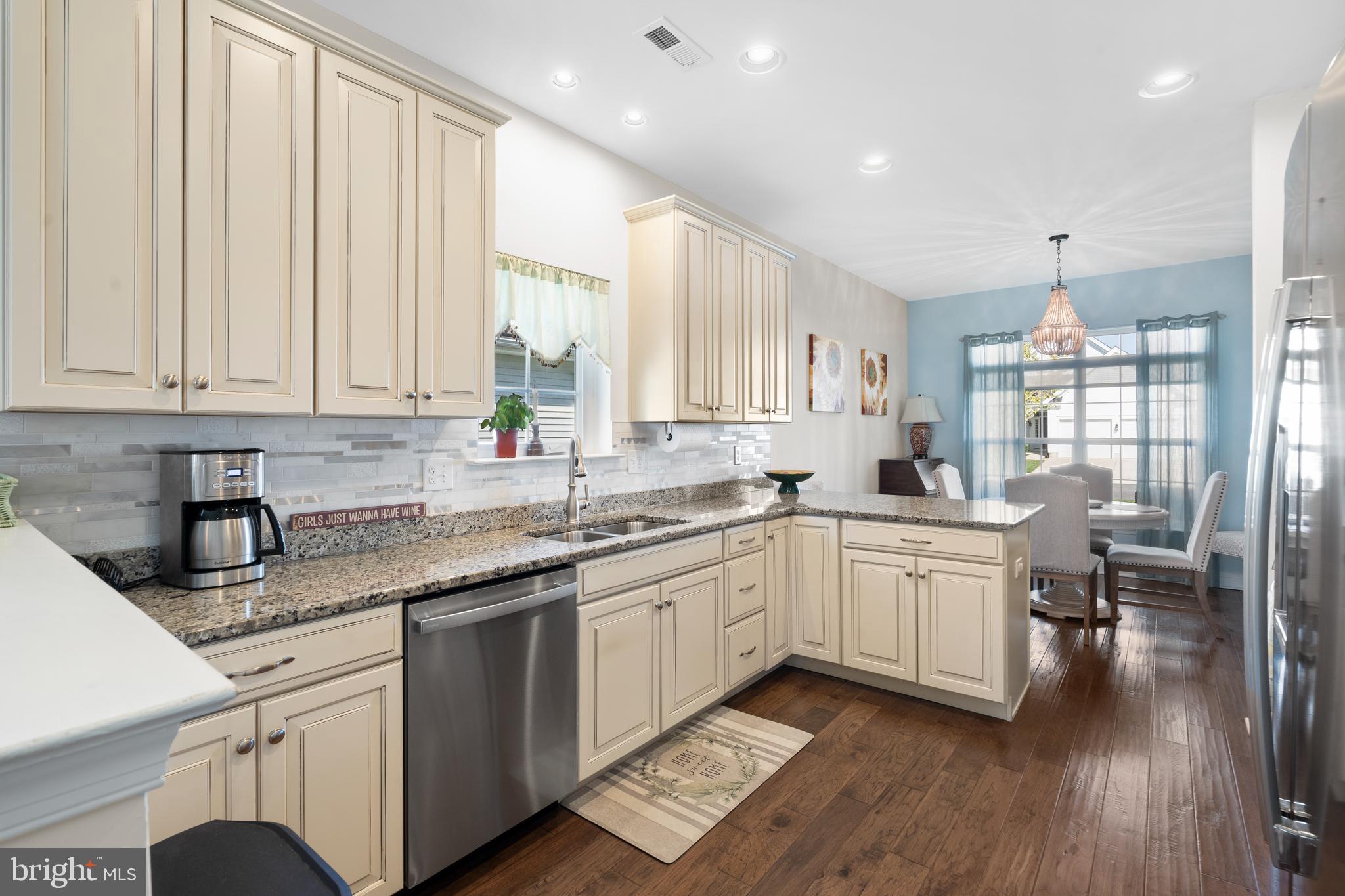 118 Field Loop Glassboro, NJ 08028 - Photo 10 of 51 a kitchen with sink cabinets and wooden floor