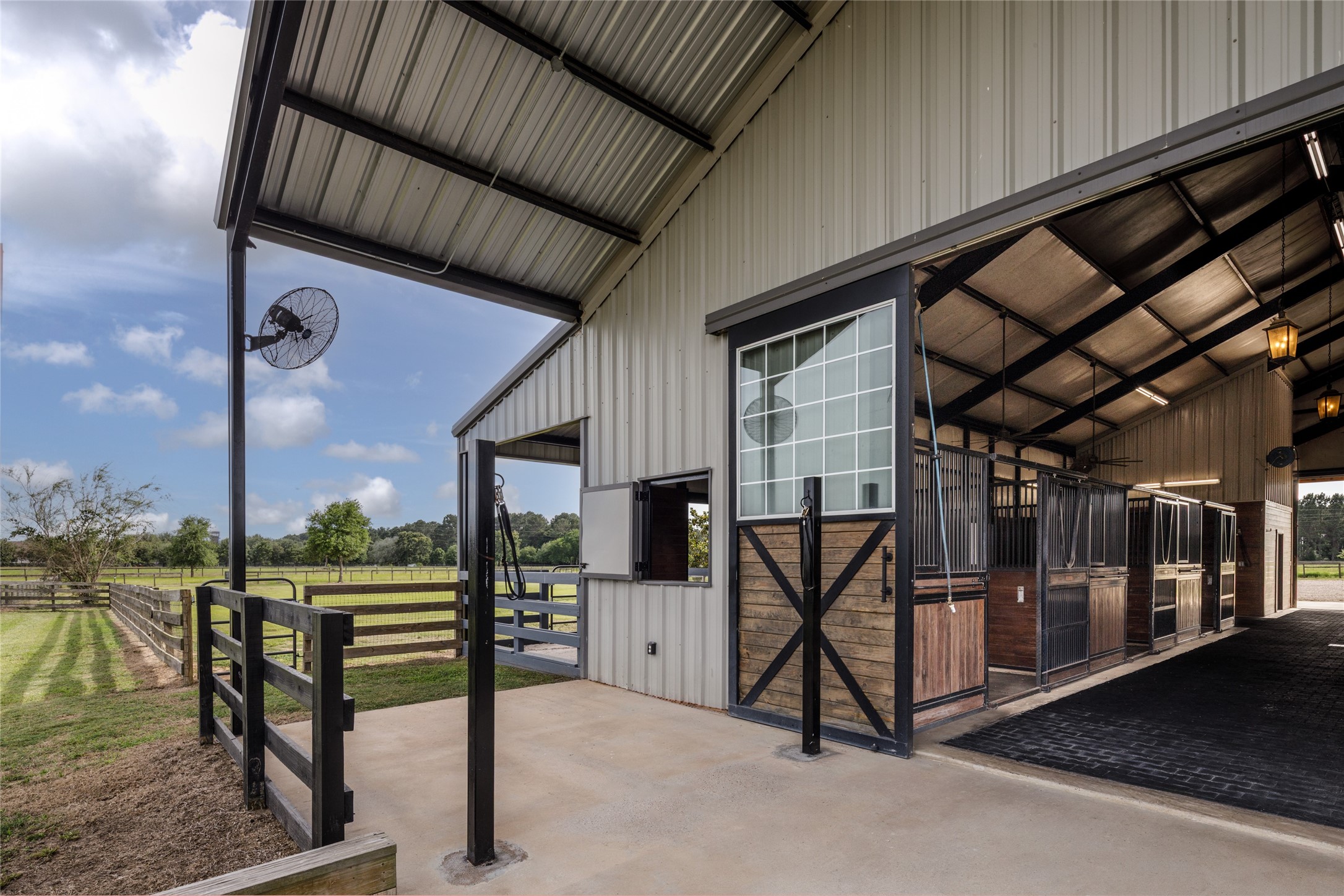 24118 Margerstadt Road Hockley, TX 77447 - Photo 6 of 49 Cross fenced paddocks, geo-grid turnout runs, and open grazing areas were designed to support both horse comfort and efficient daily equestrian use across the property. The surrounding pasture and unobstructed riding space reinforce the openness that defines Paloma Ridge Farm.