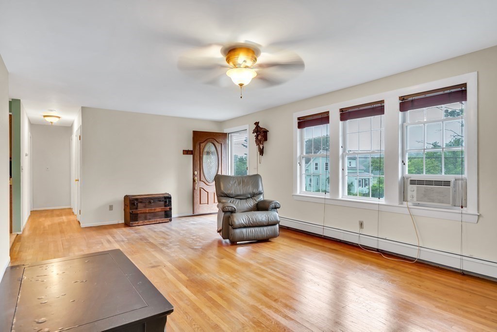 184 West Acton Road Stow, MA 01775 - Photo 13 of 35 a living room with furniture and a large window