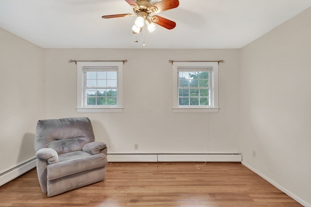 184 West Acton Road Stow, MA 01775 - Photo 15 of 35 a living room with furniture and a window
