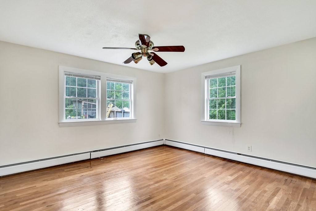 184 West Acton Road Stow, MA 01775 - Photo 17 of 35 wooden floor in an empty room with a window